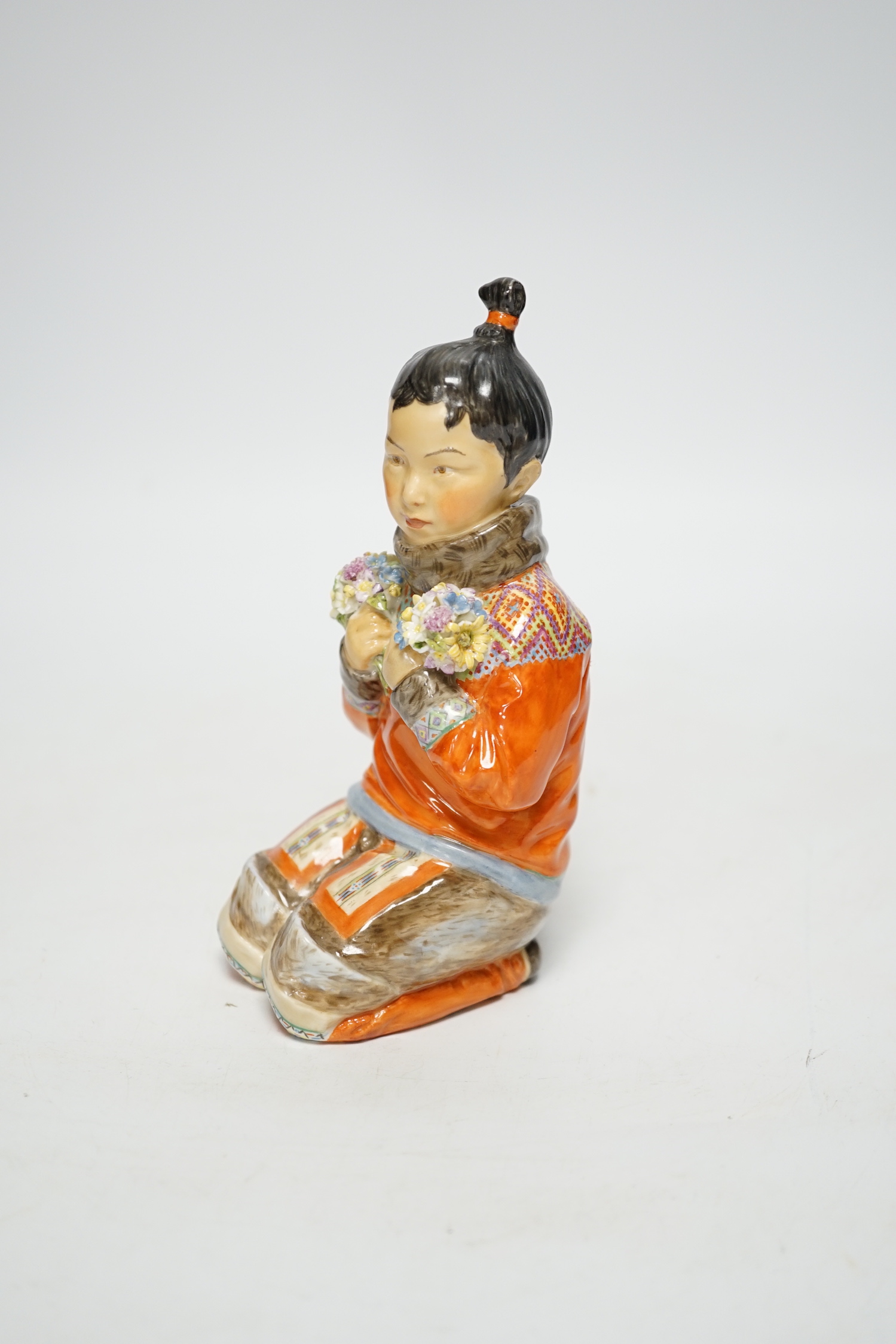 A Royal Copenhagen overglaze figure Greenlandic Girl, designed by Carl Martin-Hansen, National Costume Series, 15cm high